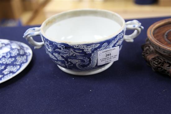 A Chinese blue and white bowl and cover, wood stand